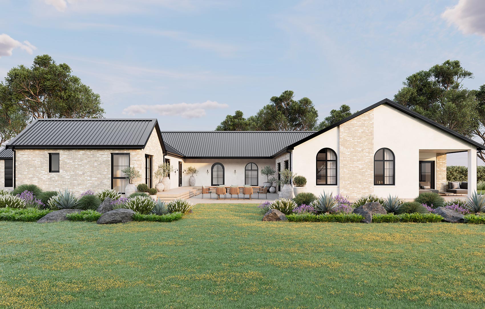 Modern white house with landscaped garden.